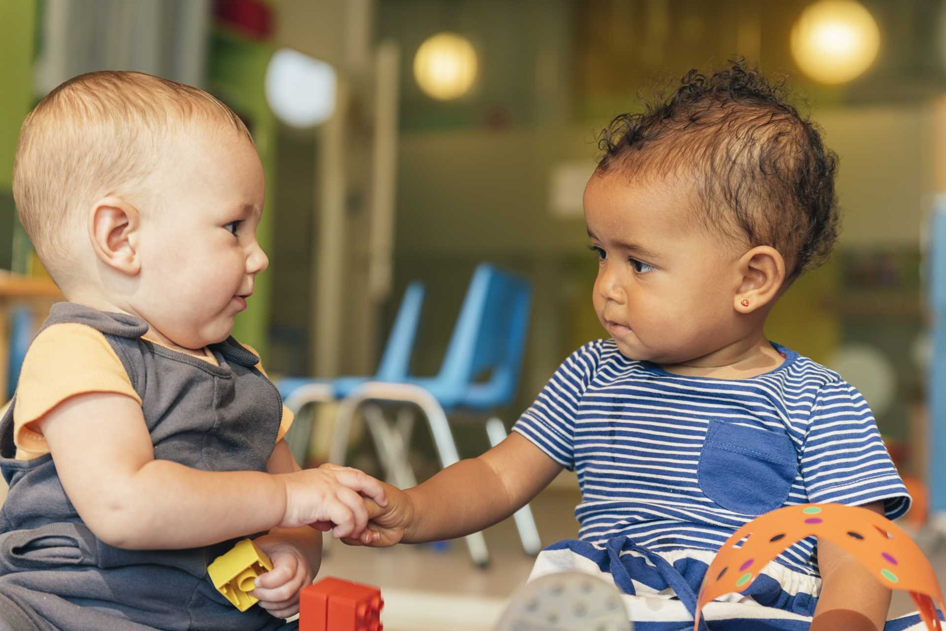babies playing with toys