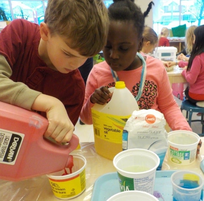 Kids painting and doing a craft.